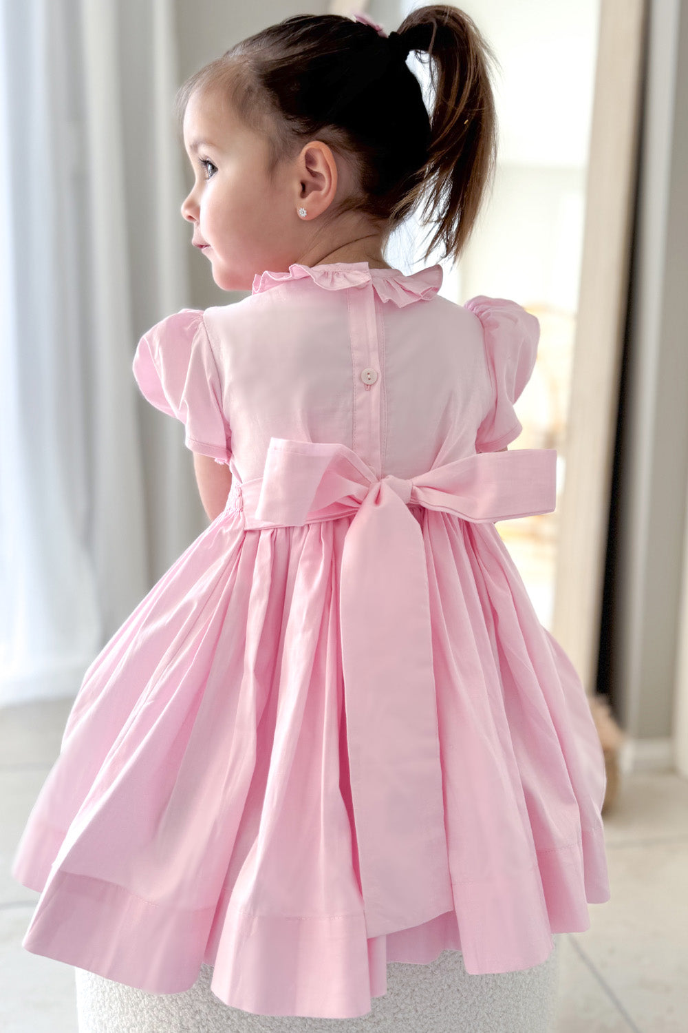 Beautiful Pink girls dress with sash bow and hand smocked