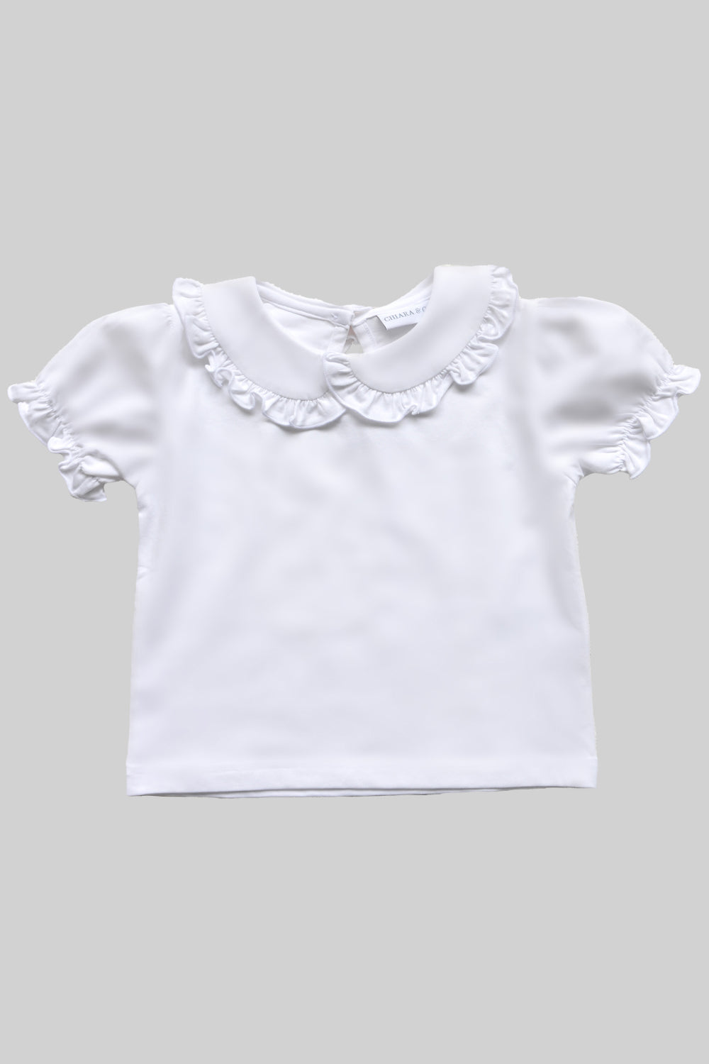 Girls white classic top with ruffled trim collar and puff sleeves,