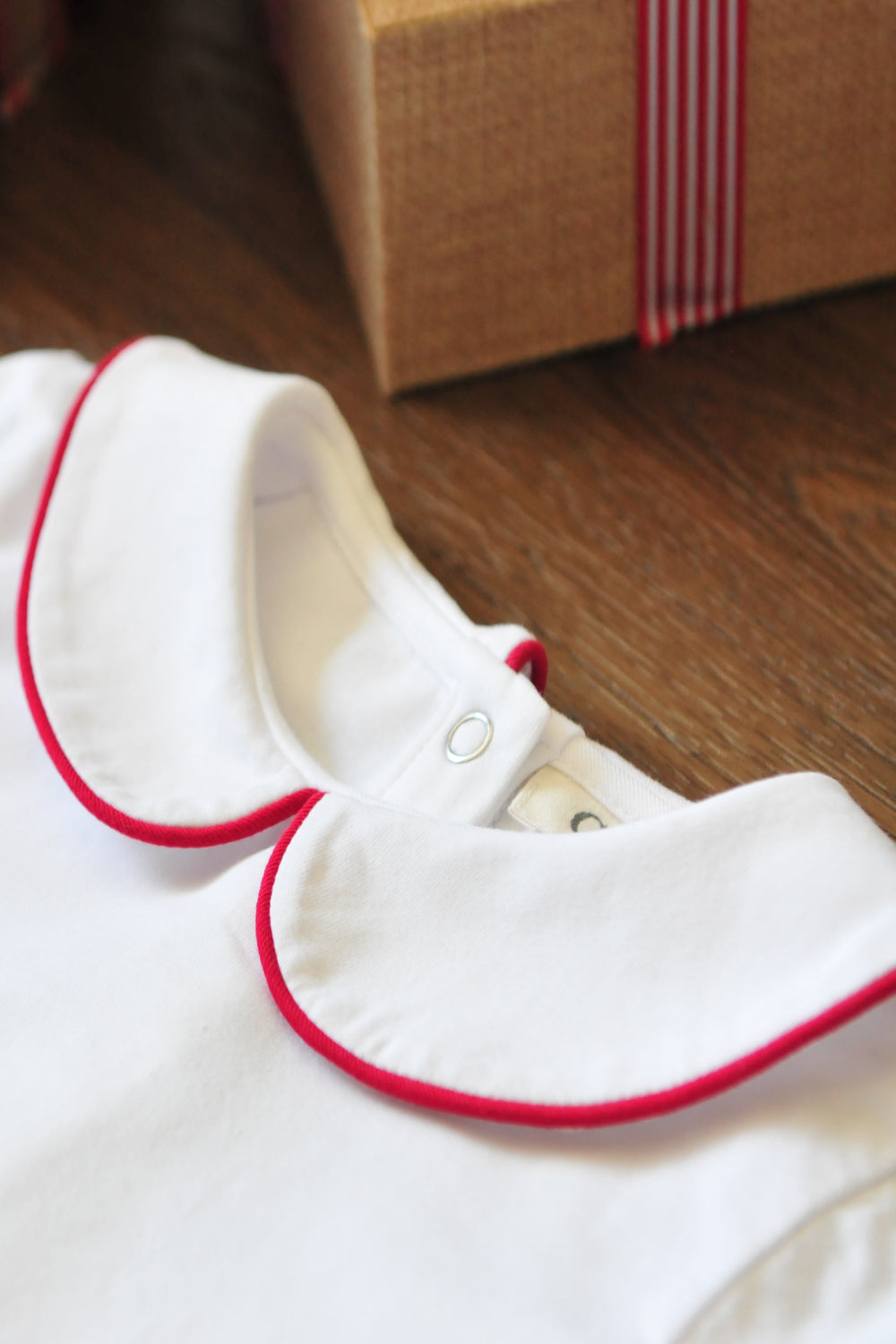 red piped collar onesie